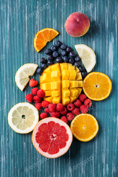 Preview: Slices Of Fresh Fruits Over Metal Blue Background. Top View