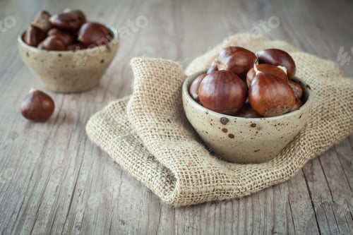 Preview: Bunch Of Fresh Chestnuts In A Bowl On Wooden Table