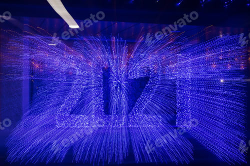 Preview: Lettering of 2021 Made With A Garland. Motion Blur. Zoom Burst Technique. Abstract Background