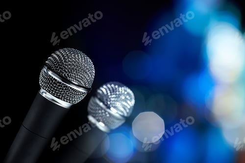 Preview: Closeup Of Two Modern Microphones With Silver Mesh, On Abstract Background.