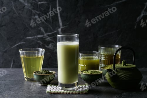 Preview: Variety Of Matcha Tea Served With Sencha And Matcha Powder Over Dark Wooden Background