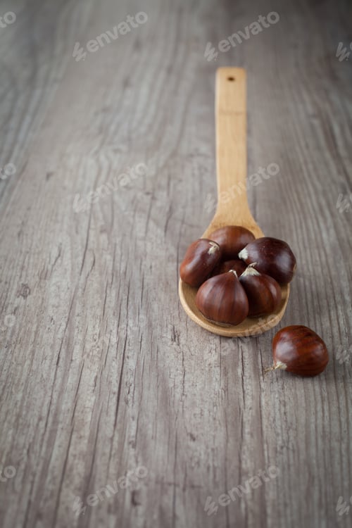 Preview: Bunch Of Fresh Chestnuts On A Wooden Spoon