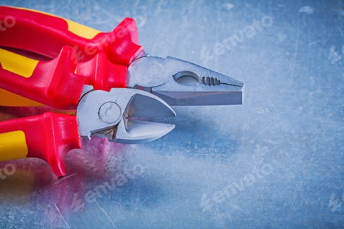 Preview: Pliers Wire Cutter On Metallic Background Electricity Concept.