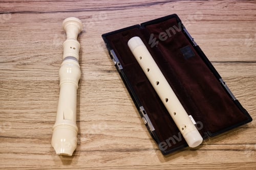 Preview: Alto Recorder Flute On A Wooden Table With A Red Case, Closeup