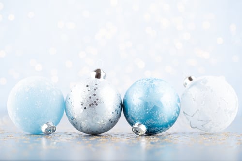 Vista previa: Christmas Ball Background. Greeting Card Decorations On A Blue Bokeh Background.