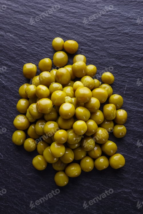 Preview: Canned Green Peas On A Dark Stone Background