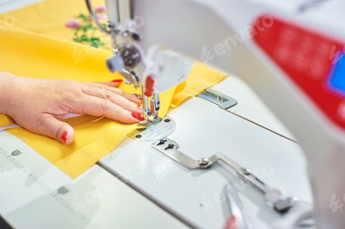 Preview: Industrial Sewing Machine And Hand Seamstress. Close-Up.