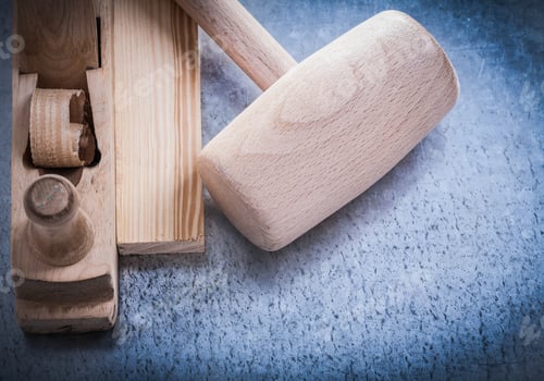 Preview: Planer Lump Hammer Wooden Brick On Metallic Background Construction Concept.