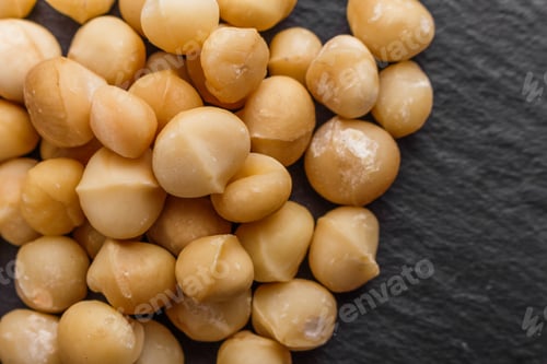 Preview: Delicious Macadamia Nuts On A Dark Stone Background