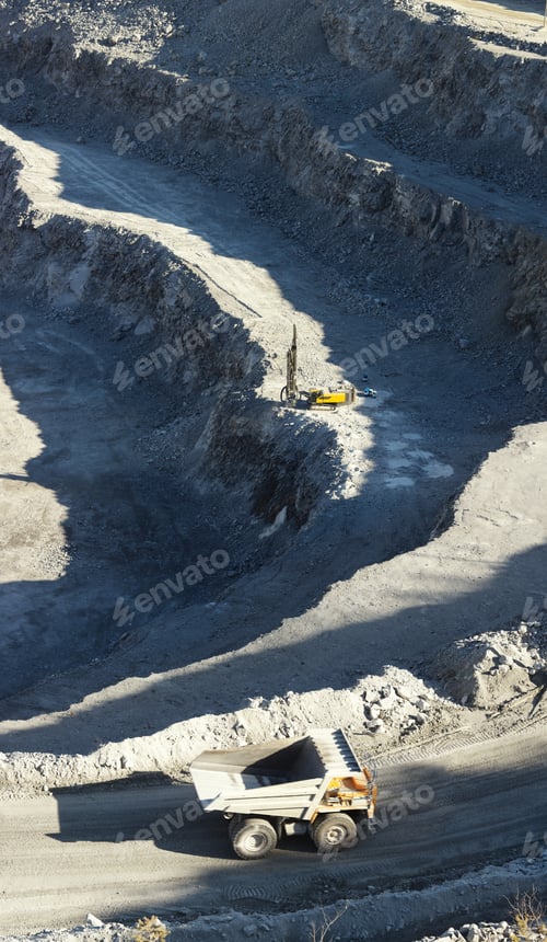 Preview: Drilling Machine And Mining Truck In A Stone Quarry, Top View, Vertical Panorama.