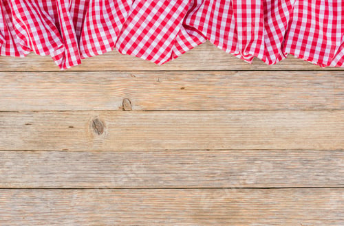 Vista previa: Red Table Cloth On Rustic Wooden Background.