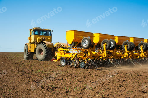 Preview: Farmer In Tractor Preparing Farmland With Seedbed For The Next Year