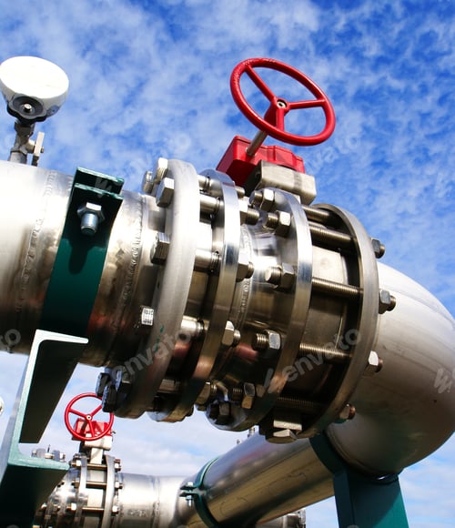 Preview: Industrial Zone, Steel Pipelines And Valves Against Blue Sky