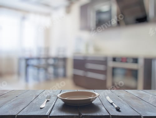 Preview: Empty Plate With Fork And Knife On Wooden Table In The Living Room