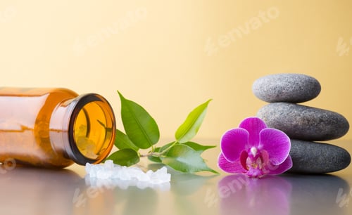 Preview: Spa Stones With Pink Orchid And Sea Salt, On Glossy Yellow Background.