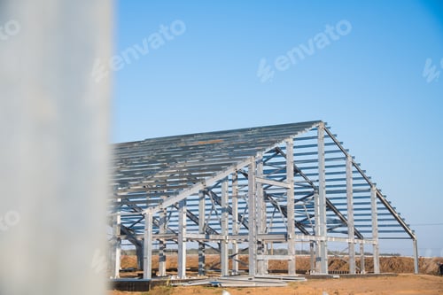 Preview: Steel Frame Workshop Is Under Construction Against A Blue Sky. New Technology Steel Frame For