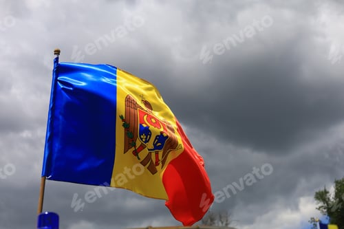 Preview: The Official Flag Of The State Of The Republic Of Moldova Against The Sky.