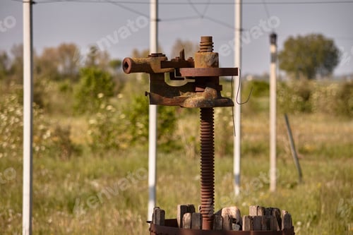 Preview: Detail Of An Old Metal Press Used As An Ornamental Element In A Garden