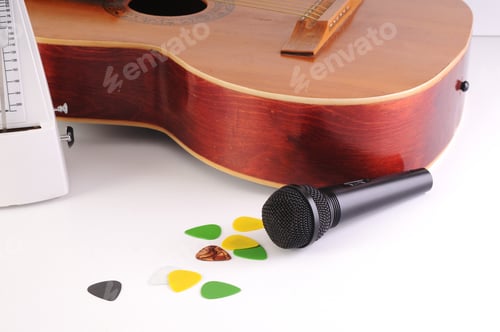 Preview: Guitar And Microphone On A White Background