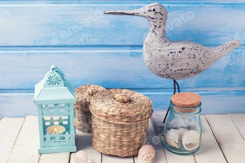 Preview: Nautical Theme Objects. Decorative Bird, Lantern, Shells On White Wooden Background Against Blue