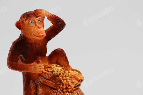 Preview: Typical Ceramic Statuette Of A Monkey, On A Light Background
