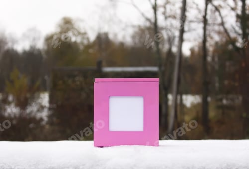 Preview: Decorative Pink Gift Box Standing On Fresh Snow Outdoors