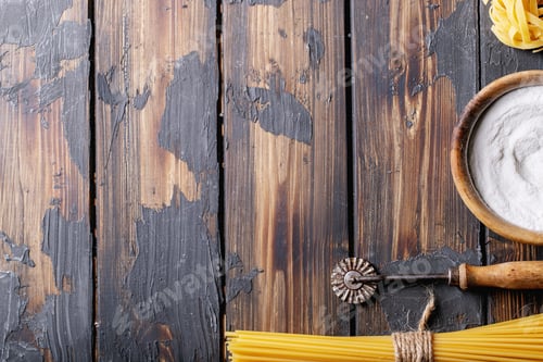 Preview: Raw Ingredients For Cooking: Italian Spaghetti Pasta And Flour Over Dark Wooden Background. Top