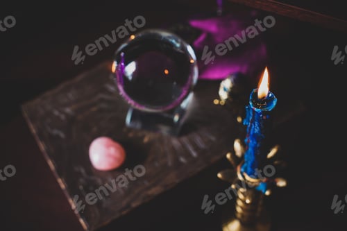 Preview: A Fortune Teller, Witch Stuff On A Table, Candles And Fortune-Telling Objects. The Concept Of