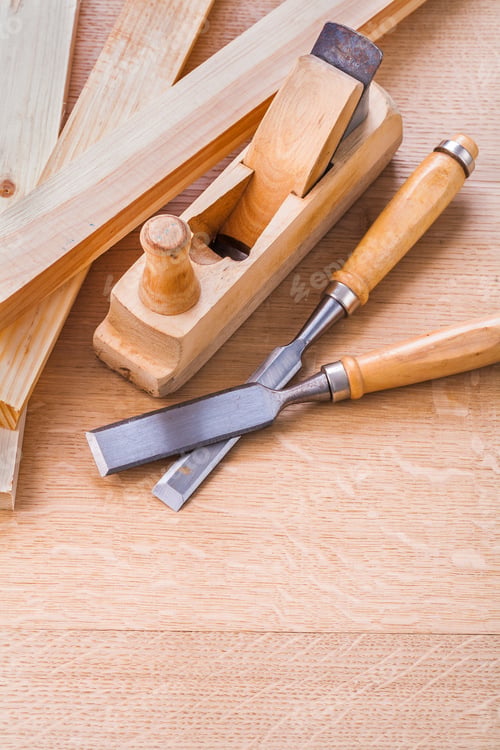 Preview: Chisels And Woodworkers Plane On Wooden Board