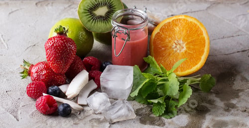 Preview: Berry, Multifruit And Banana Smoothies Served With Various Berries And Fruits Over A Stone