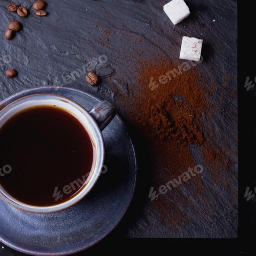 Preview: A Cup Of Coffee On Black Slate Board With Coffee Beans, Sugar And Tiny Sugar Tongs. Male Hands