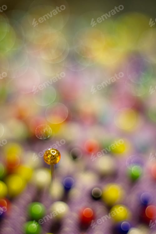 Preview: Color Sewing Pins And Detail Of Reflection For Colored Abstract Background.