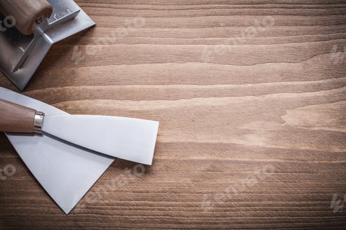 Preview: Two Paint Scrapers And Surfacer On Wooden Board.