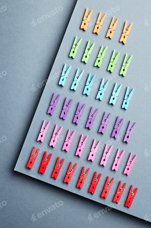 Preview: Laundry Clips Organized Over Dark Gray Background, Top View
