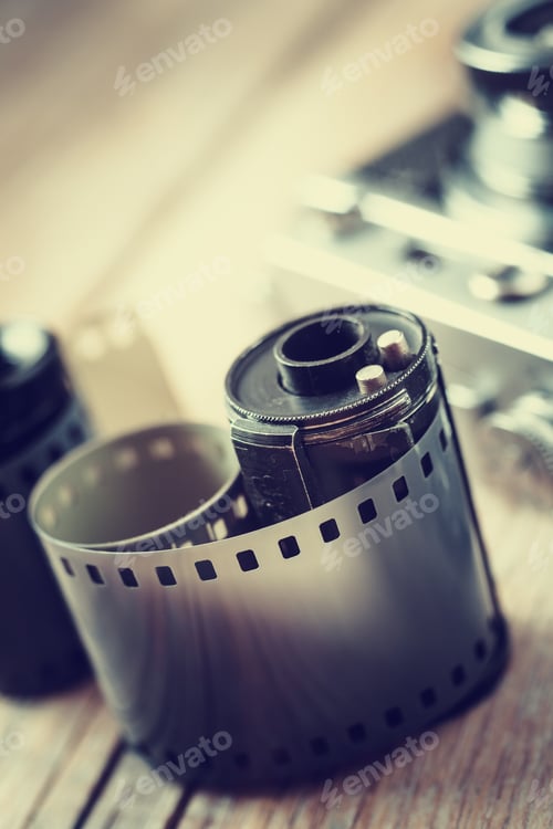 Preview: Old Photo Film Rolls, Cassette And Retro Camera On Background. Vintage Stylized.