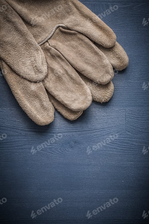 Preview: Two Safety Gloves On Blue Board.
