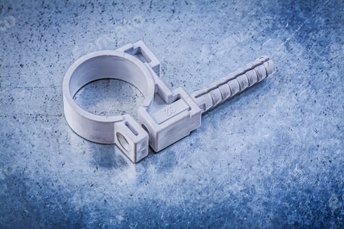 Preview: Plastic Water Pipe Clamp On Metallic Background Construction Concept.