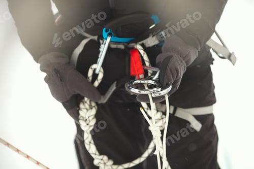 Preview: Safety Climbing Equipment In The Hands Of A Mountaineer Close-Up. Eight.
