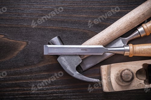 Preview: Set Of Claw Hammer Planer And Firmer Chisels On Vintage Wooden Board Construction Concept.