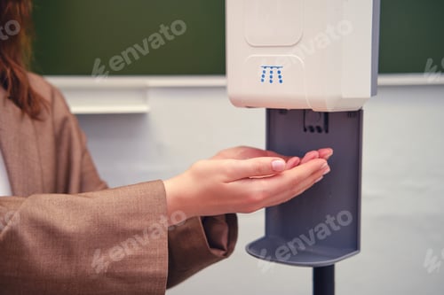Preview: Teacher Hands At The Dispenser With Antibacterial Disinfection Soap
