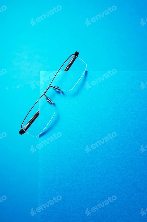 Preview: Simple And Modern Eye Glasses Over Blue Background