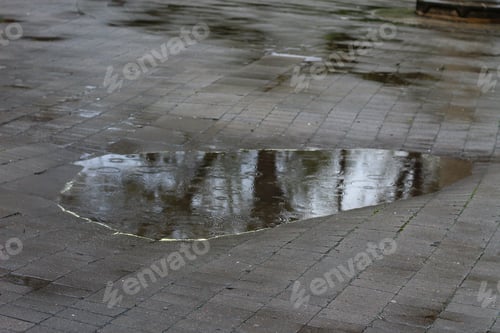 Preview: Large Pedestrian Impassable Puddles In An Urban Environment On A Rainy Day