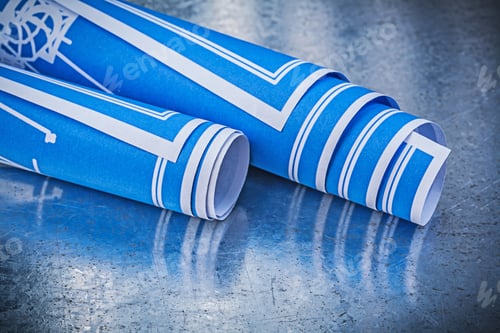 Preview: Stack Of Blue Construction Drawings On Metallic Background Building Concept.