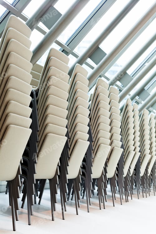 Preview: Stackable Chairs On The Glass Wall Of Business Building