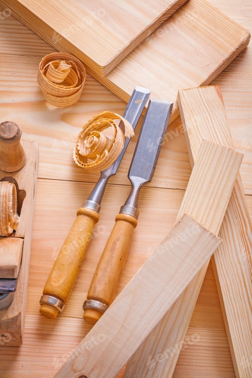 Preview: Carpentry Chisels And Plane On Wooden Boards