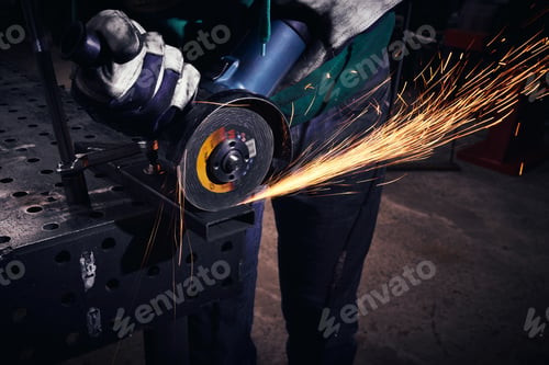Preview: Heavy Industry Worker Cutting Steel With An Angle Grinder