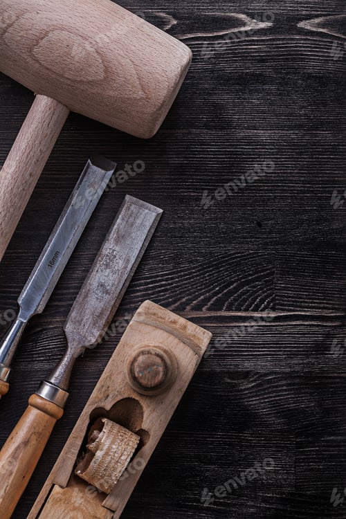 Preview: Chisels Wooden Mallet Shaving Plane On Wood Board Construction Concept.