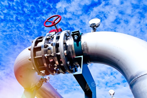 Preview: Industrial Zone, Steel Pipelines And Valves Against Blue Sky