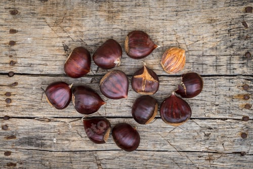 Preview: Fresh Raw Chestnuts On A Wooden Background