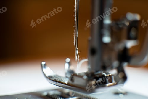 Preview: Machine Sewing Fabric, Needle With Thread In The Background.